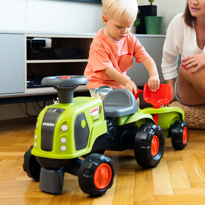 Trattore a spinta Claas Arion con rimorchio e set per la sabbia