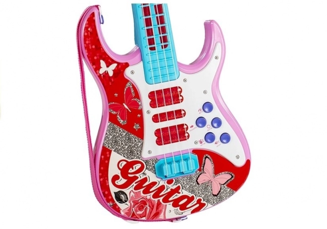 pink toy electric guitar with microphone and strings