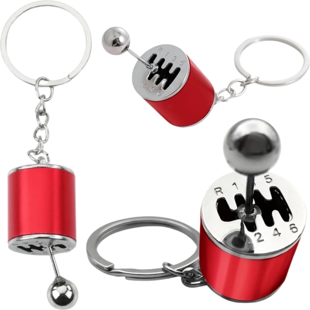 Metalen sleutelhanger in de vorm van een handgeschakelde versnellingsbak – rood