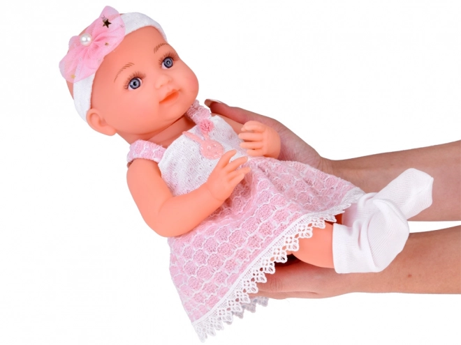 Rubber Baby Doll in Pink Dress with Bottle and Pacifier