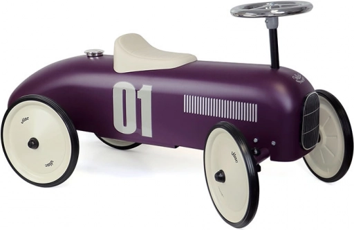 Vintage metal balance bike in dark purple color