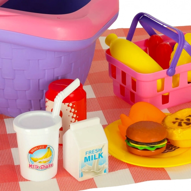 Cestino da picnic con frutta e succhi