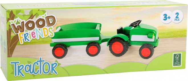 Trattore in legno piccolo verde con rimorchio
