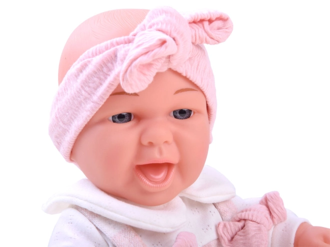 Realistic smiling baby doll