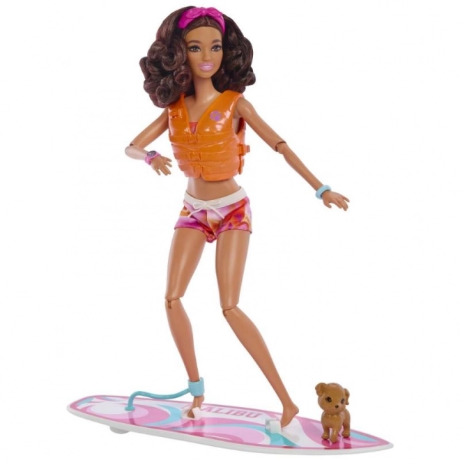 Barbie doll with surfboard