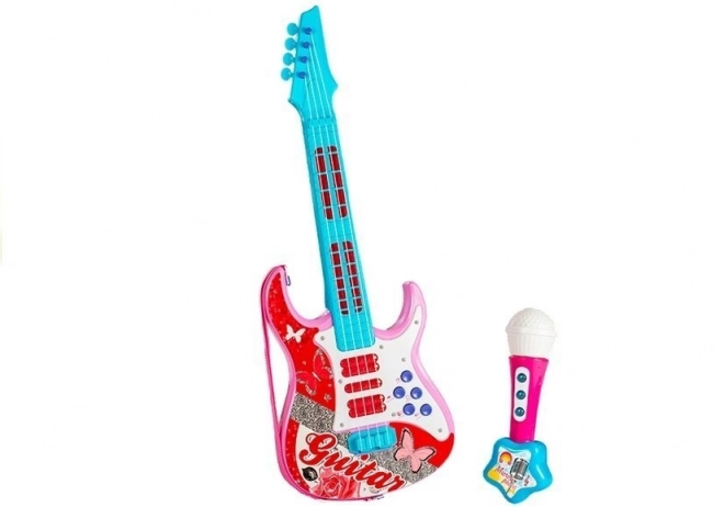 pink toy electric guitar with microphone and strings