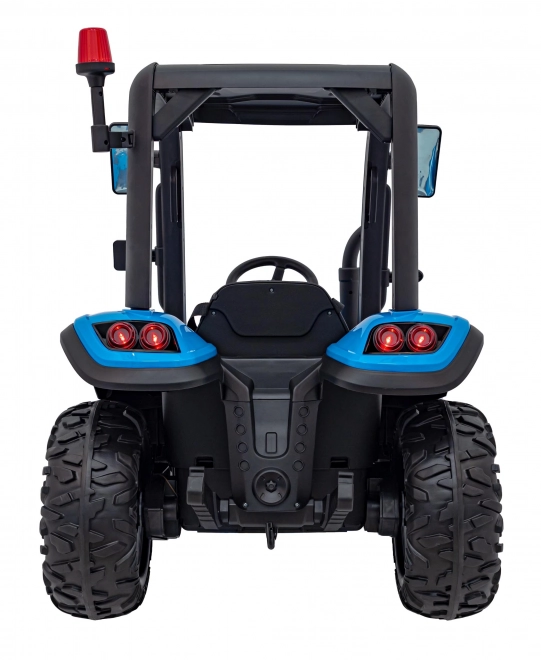 Kindertraktor mit blauem Anhänger
