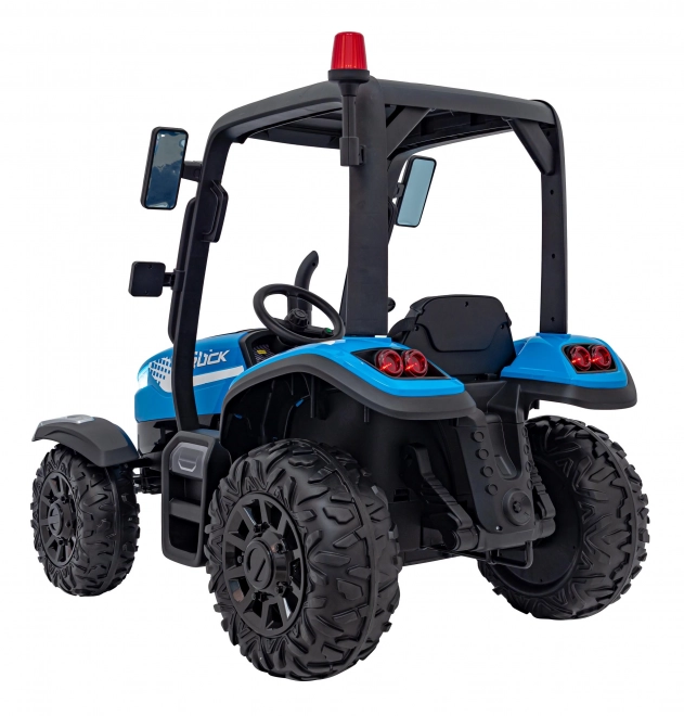 Kindertraktor mit blauem Anhänger