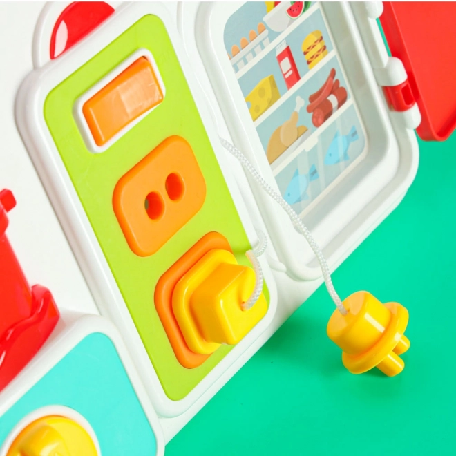 Tavola manipolativa Montessori con elementi di cucina e orologio educativo