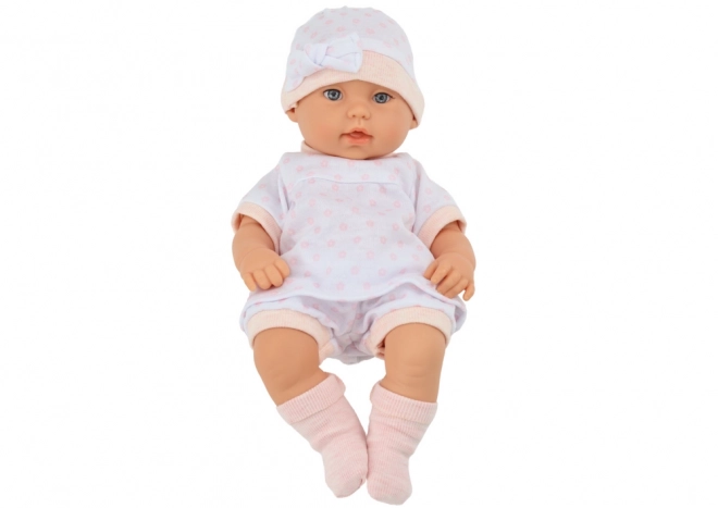 Baby Doll in White Pajamas with Blanket and Pillow