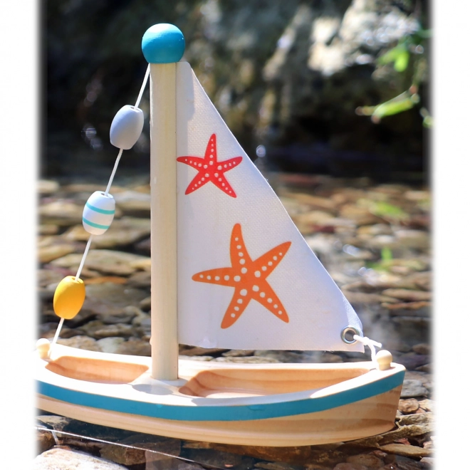 Small Foot Wooden Sailing Boat Toy with Starfish Design