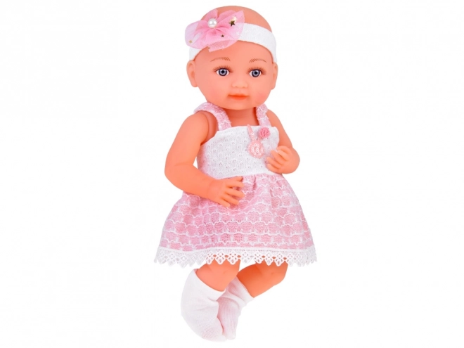 Rubber Baby Doll in Pink Dress with Bottle and Pacifier