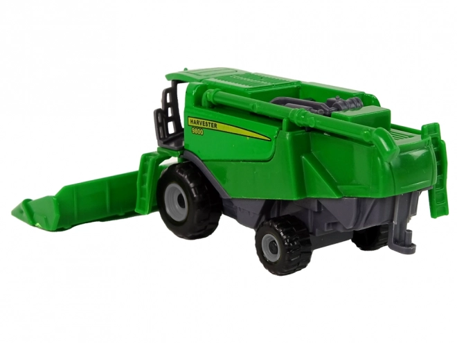 Green and Yellow Toy Farm Tractor with Seeder