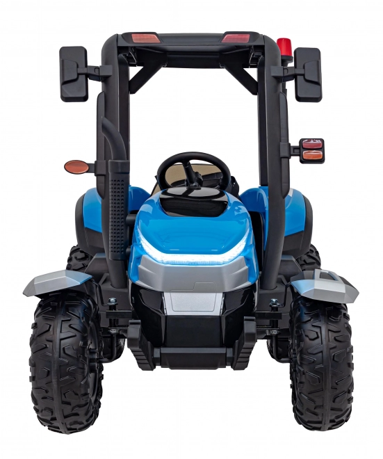 Kindertraktor mit blauem Anhänger
