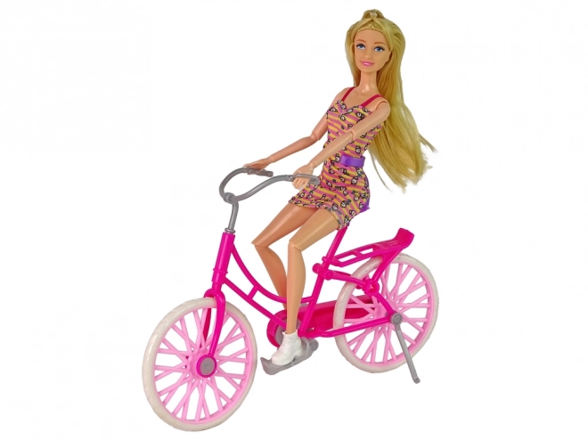 Doll on Pink Bicycle