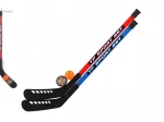 Set of field hockey sticks with floorball ball and puck