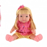 Poupée sonore 30 cm dans une pochette plastique